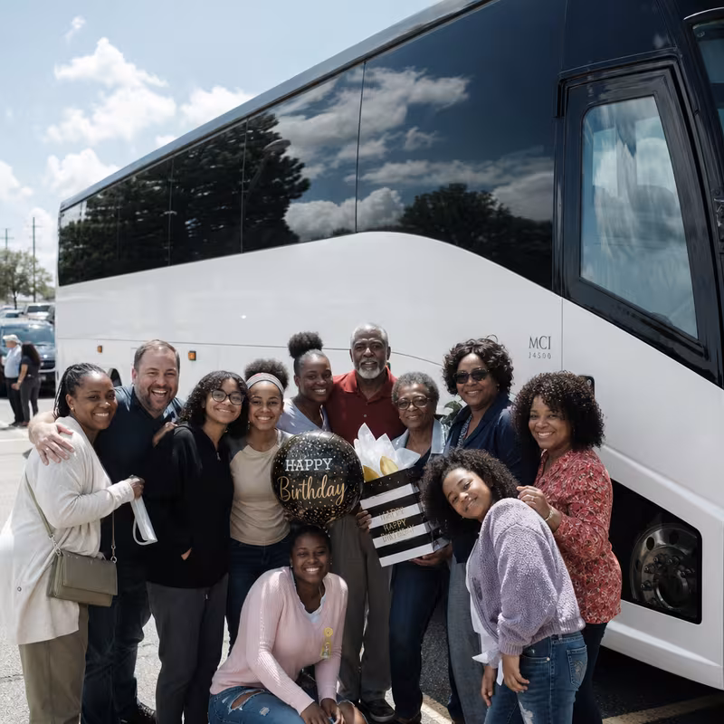 Passengers loading luggage while boarding an Tallahassee group shuttle