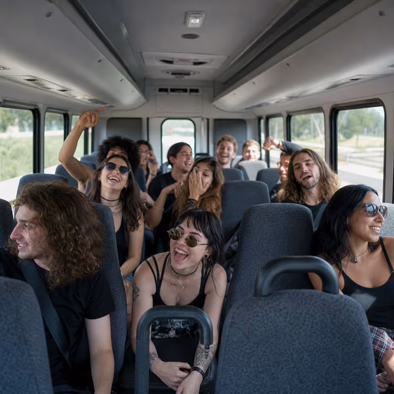 Party bus interior with wraparound leather seating and LED lighting in Tallahassee