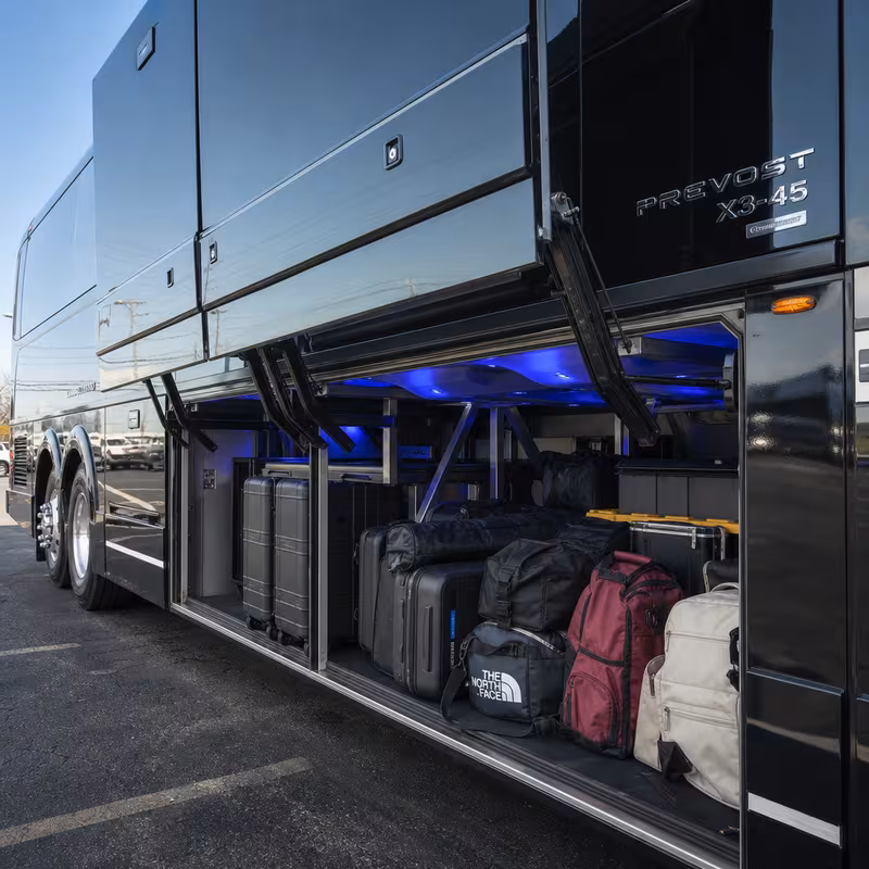 Party bus interior with wraparound leather seating and LED lighting in Tallahassee