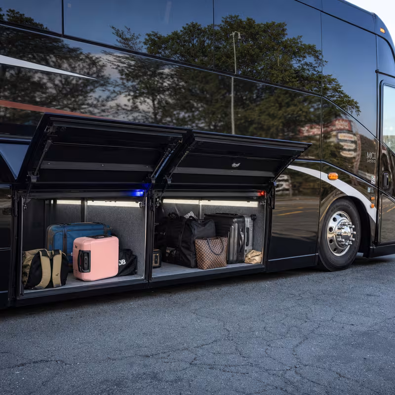 Party bus interior with wraparound leather seating and LED lighting in Tallahassee