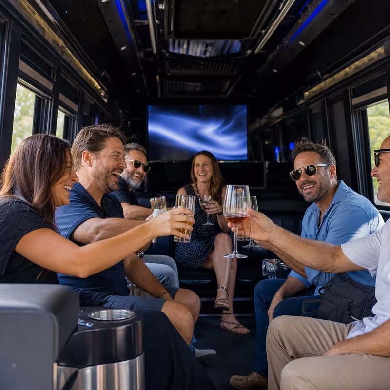 Group boarding a white charter bus for Winery & Brewery Tour Transportation transportation in Tallahassee