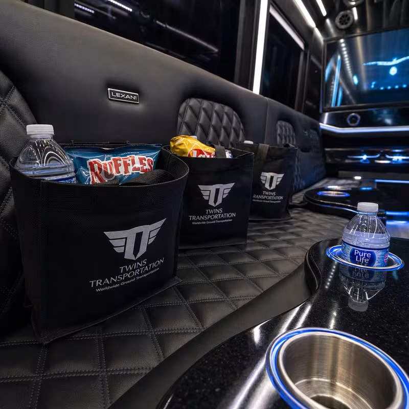 Party bus interior with wraparound leather seating and LED lighting in Tallahassee